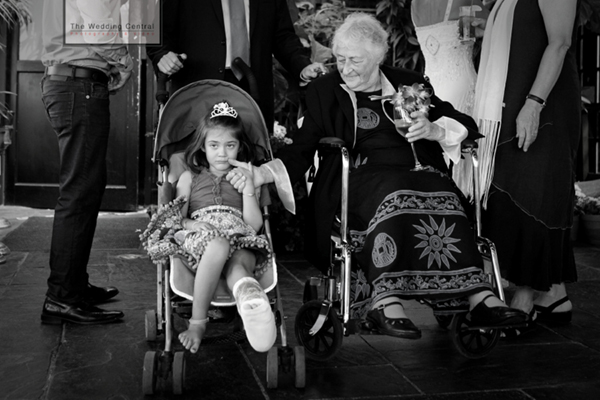 Photojournalistic Brooklyn Wedding Pictures at River Cafe - grandma and grand daughter wheel chair 