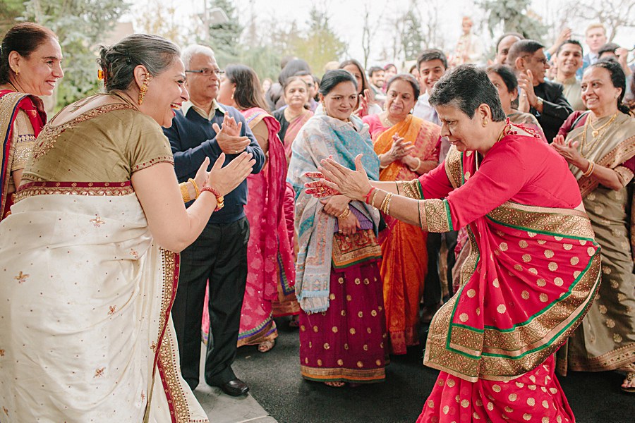 Mother of the Bride and Mother of the groom dancing during baraat