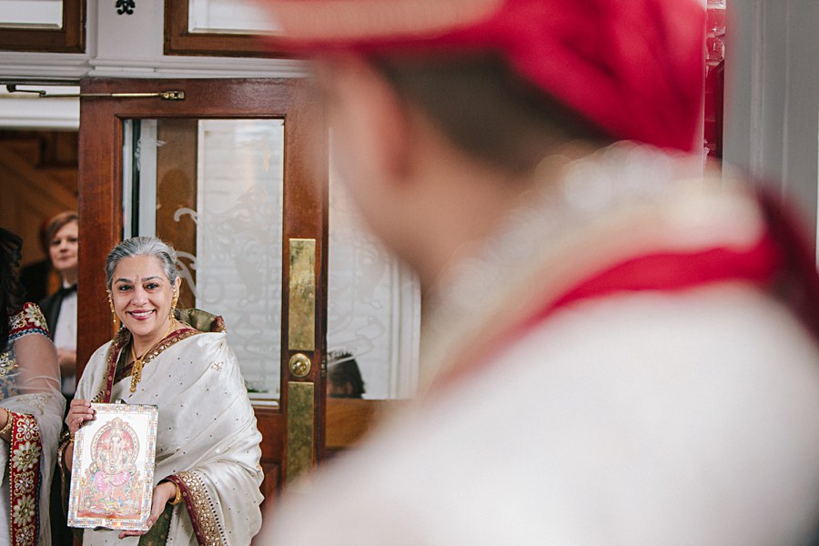 Mother of the bride welcoming groom during Indian Wedding's Baraat