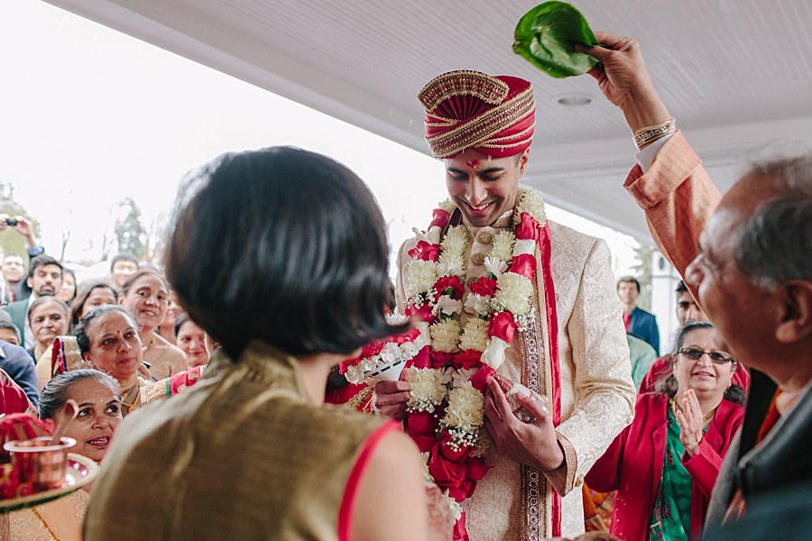 Indian Wedding Groom being welcomed during baraat