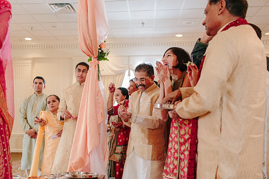 Family laughing during Indian Wedding Ceremony